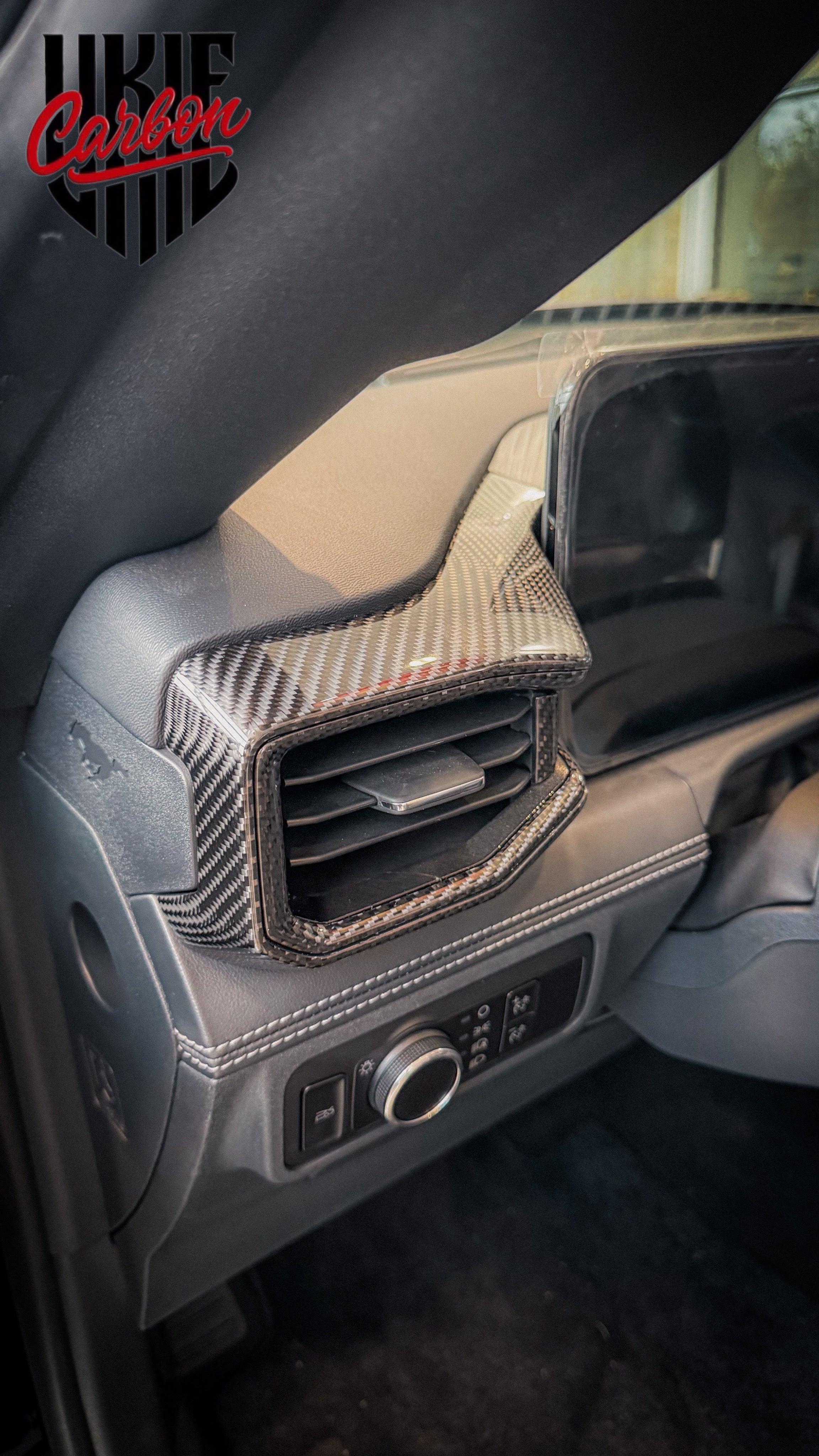 Mustang interior air vent with carbon fiber bezel trim accent installed