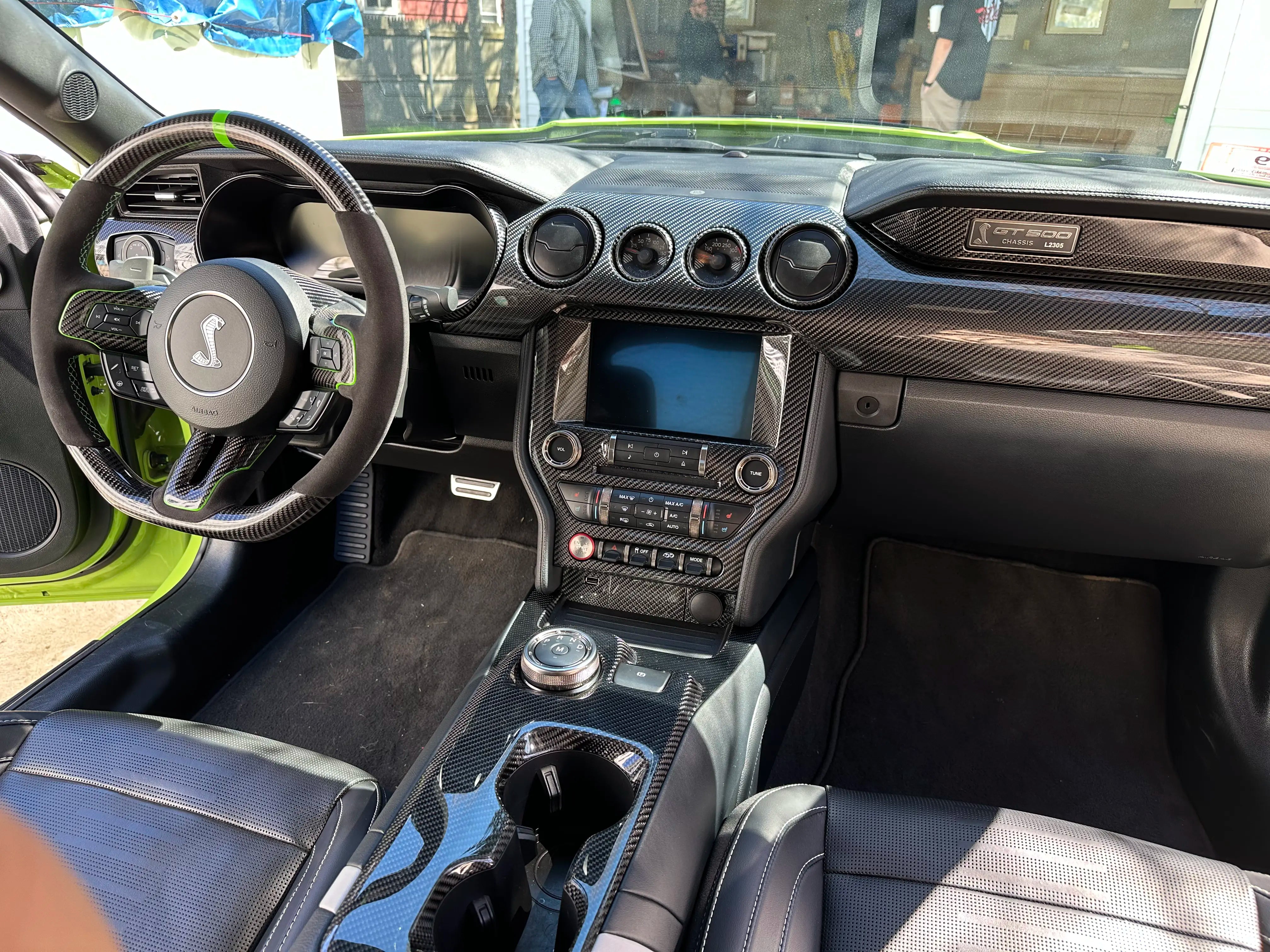 Mustang GT500 interior with carbon fiber dash trim, center console, and dashboard pieces installed by Ukie Brothers