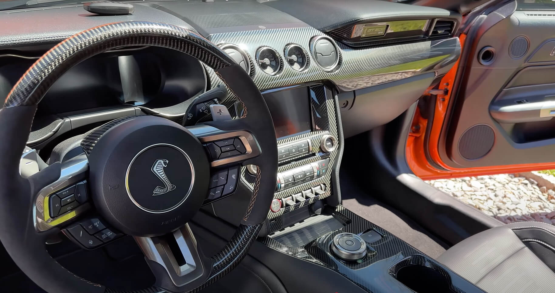 Load video: Carbon Fiber Installation for Ford Mustang