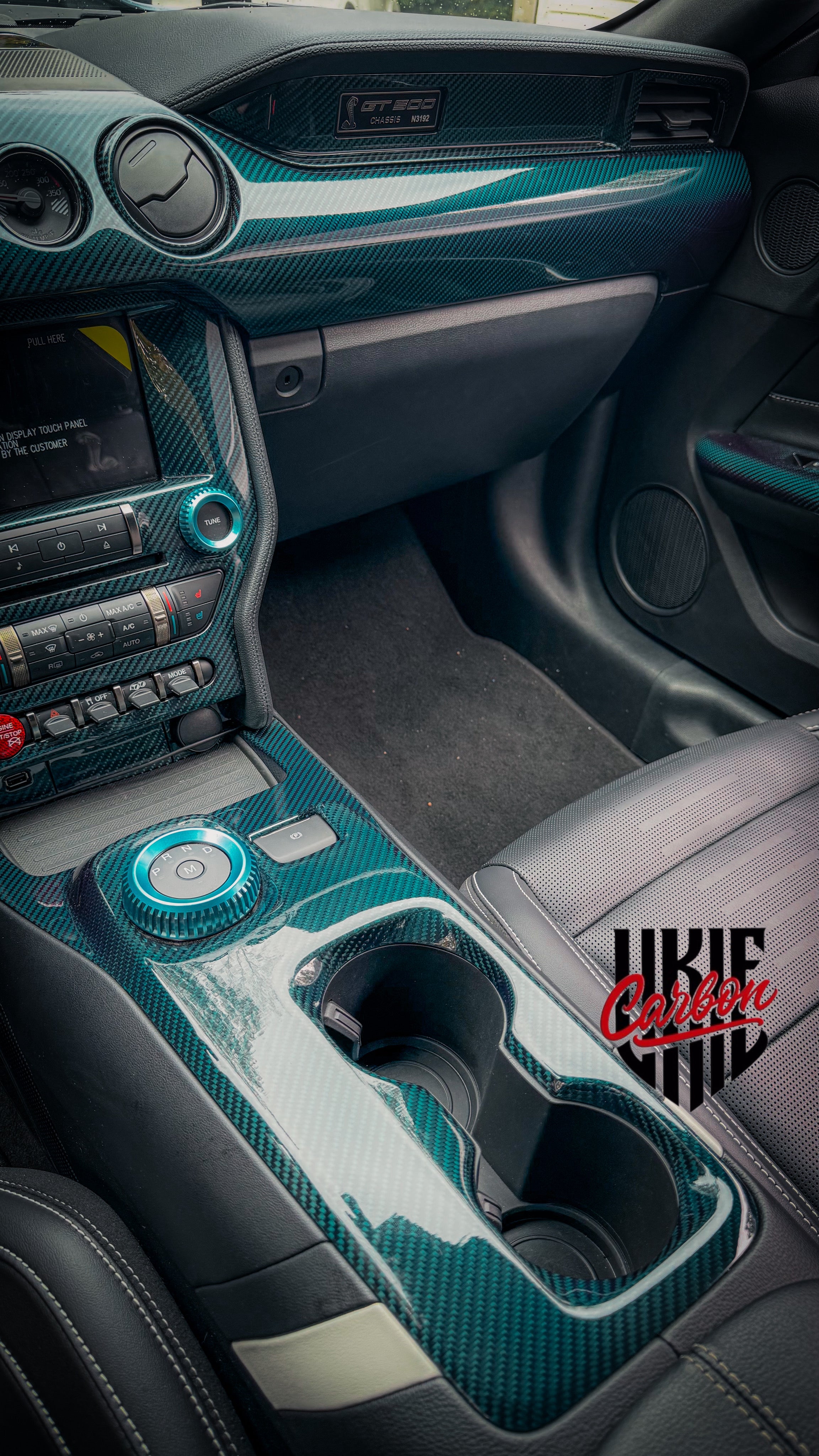 Mustang center console area with blue carbon fiber center console